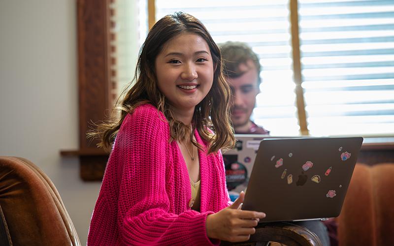 Student smiling at camera