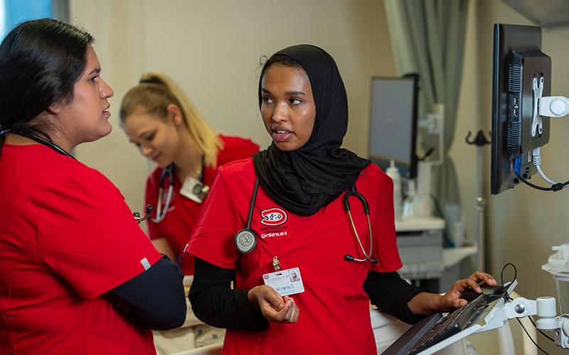 Nursing student at bedside simulation