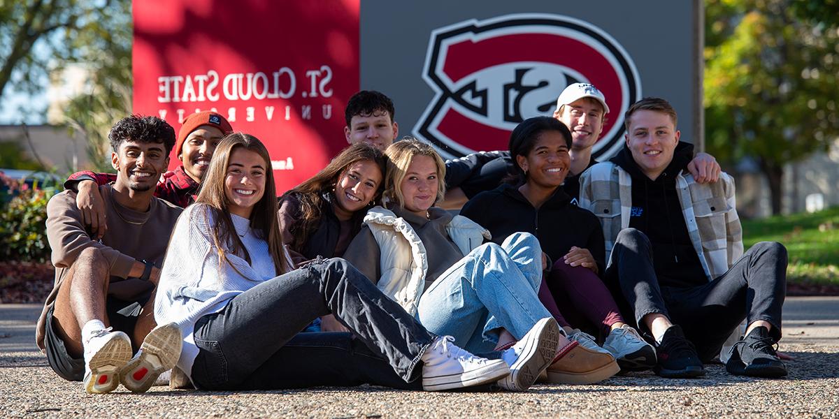 Group photo of students in front of SCSU sign