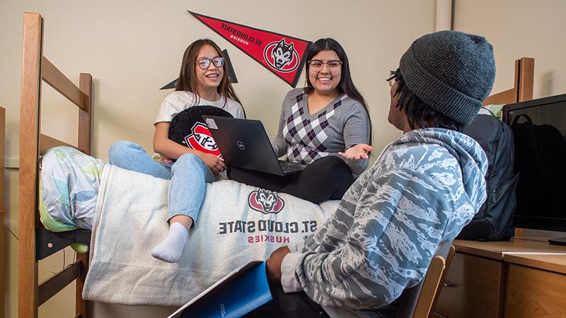 Students hanging in dorm room