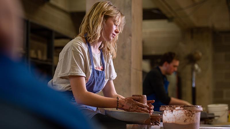 Pottery student